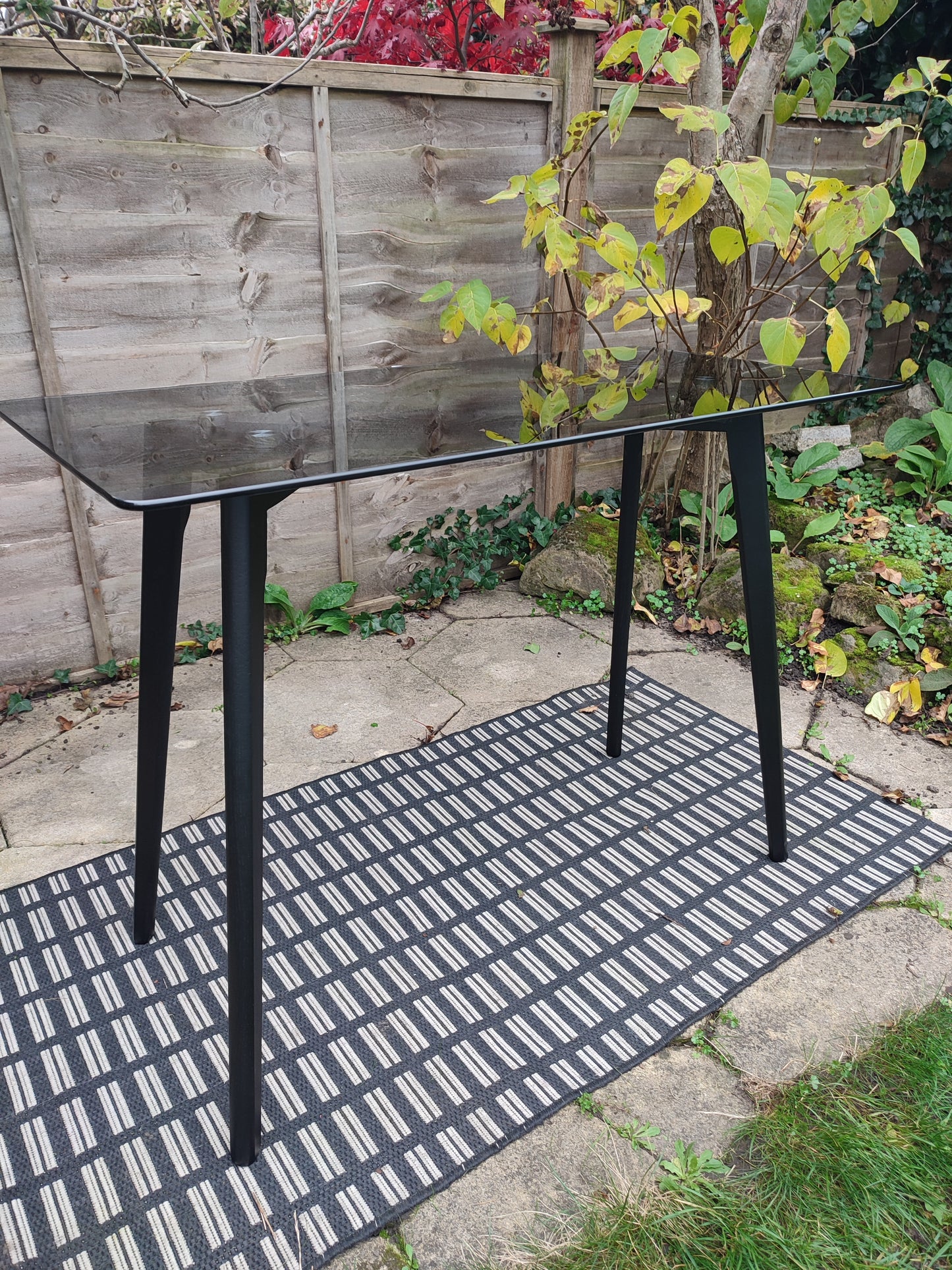 Console Table with Smoked Tempered Glass Top and Solid Oak Base in Black Finish